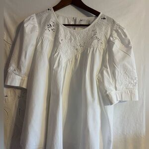 White cotton top with extensive embroidery detail, puff sleeves round neck